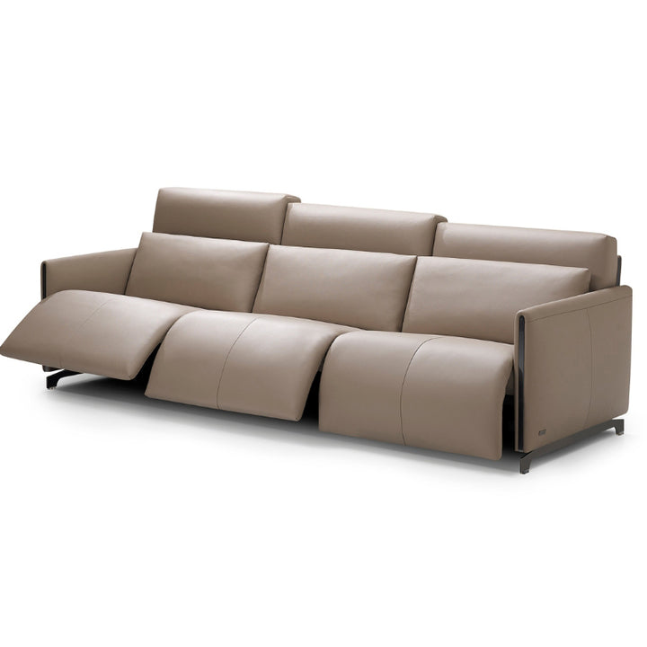 Beige sofa with reclining feature on a white background