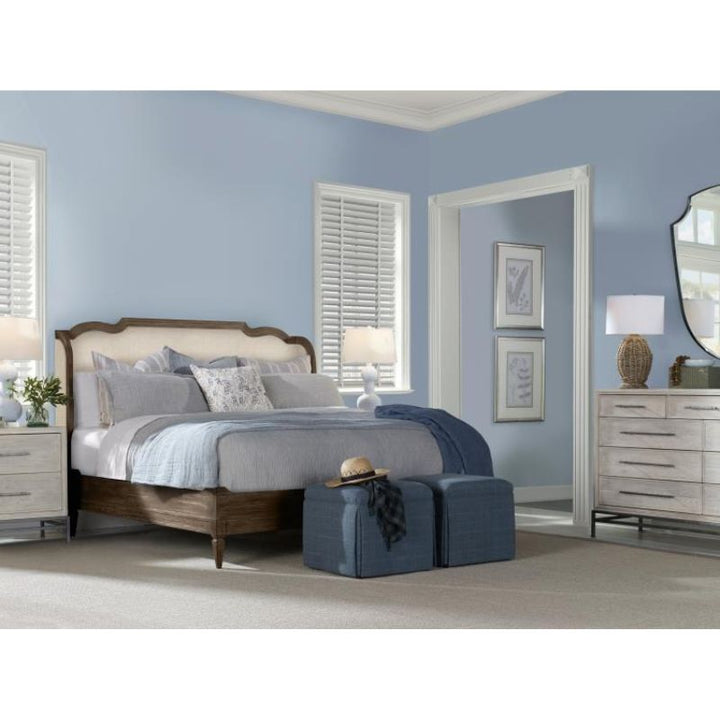 Neatly arranged bedroom with a bed, nightstands, and dresser.