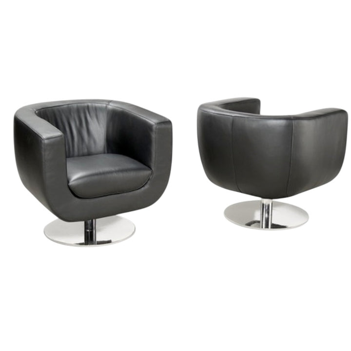 Two black leather chairs with chrome bases on a white background