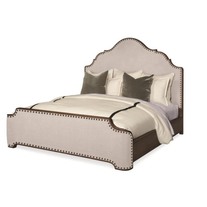 Decorative bed with beige and brown accents on a white background