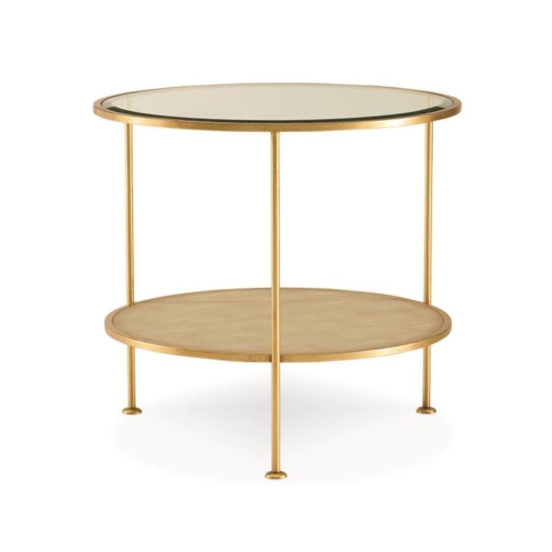 Round gold side table with glass top on a white background