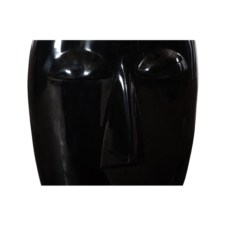 Emerging Face Sculpture